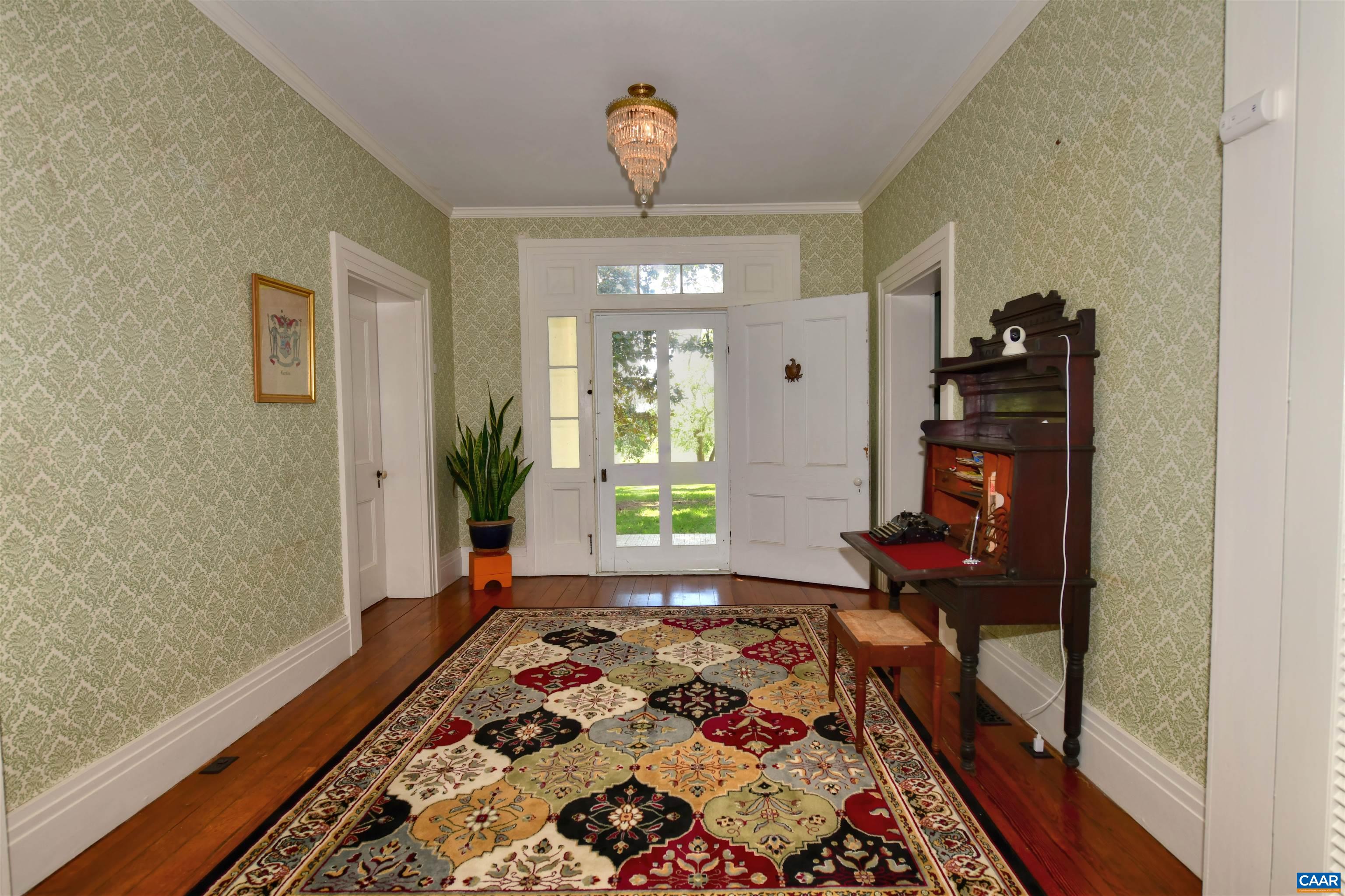 879 Evans Mill Road Dillwyn, VA 23936 - Photo 8 of 43 a bedroom with a bed and a window in it