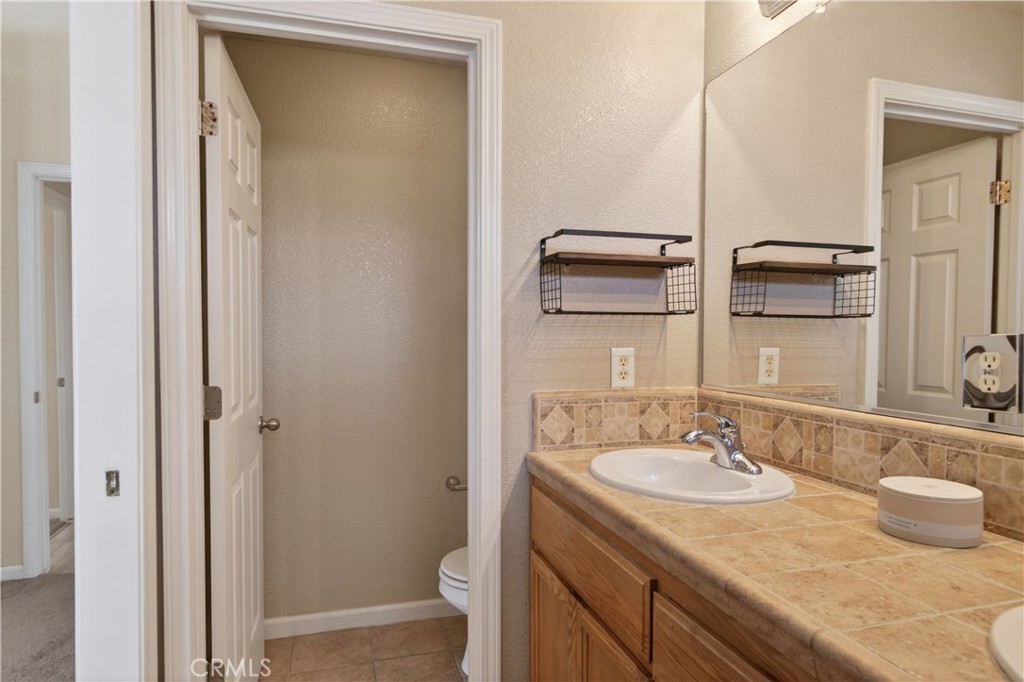 2709 Big Sandy Avenue Merced, CA 95348 - Photo 47 of 51 a bathroom with a sink and a mirror