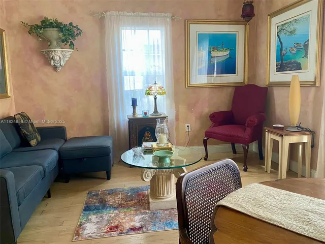 a living room with furniture and a table