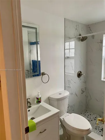 a bedroom with a bed and cupboard