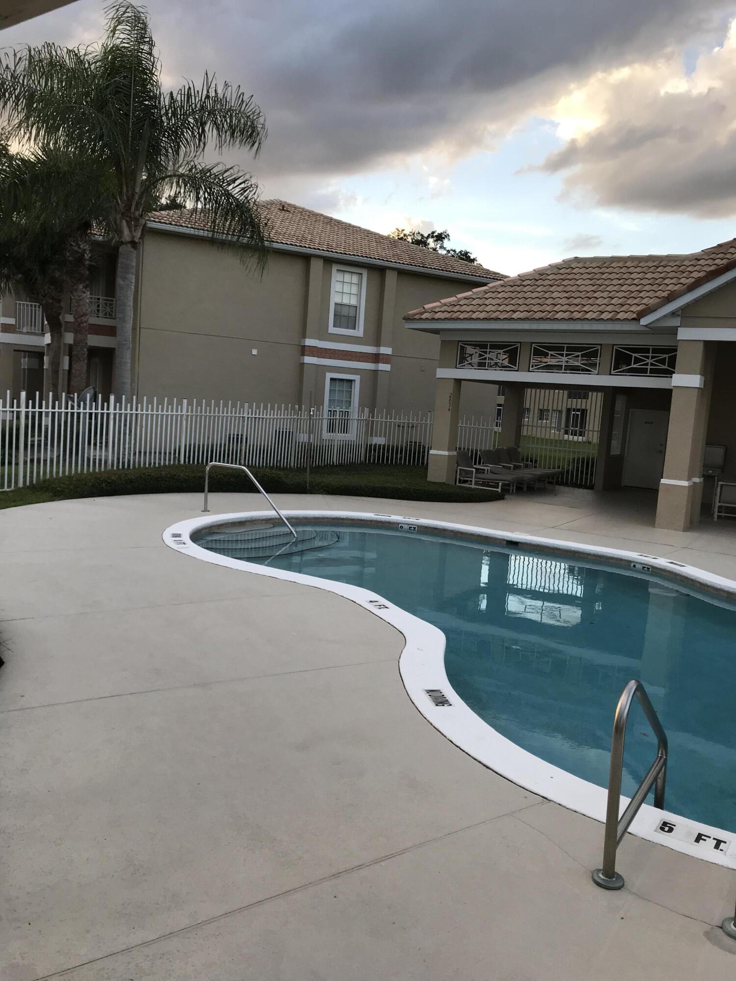 2836 Osprey Cove Place, Unit 201 Kissimmee, FL 34746 - Photo 11 of 11 an outdoor view with patio