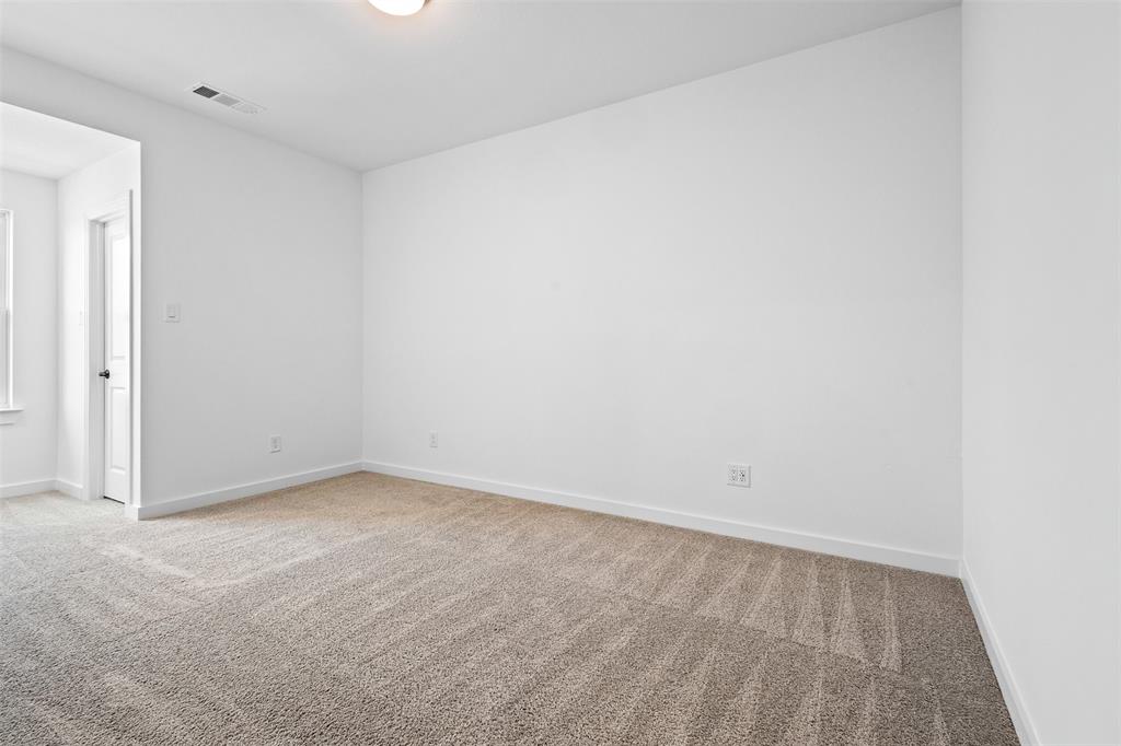 1825 Rough Rdg Trail Midlothian, TX 76065 - Photo 27 of 37 Spacious room featuring neutral carpeting, white wall paint, and white trim