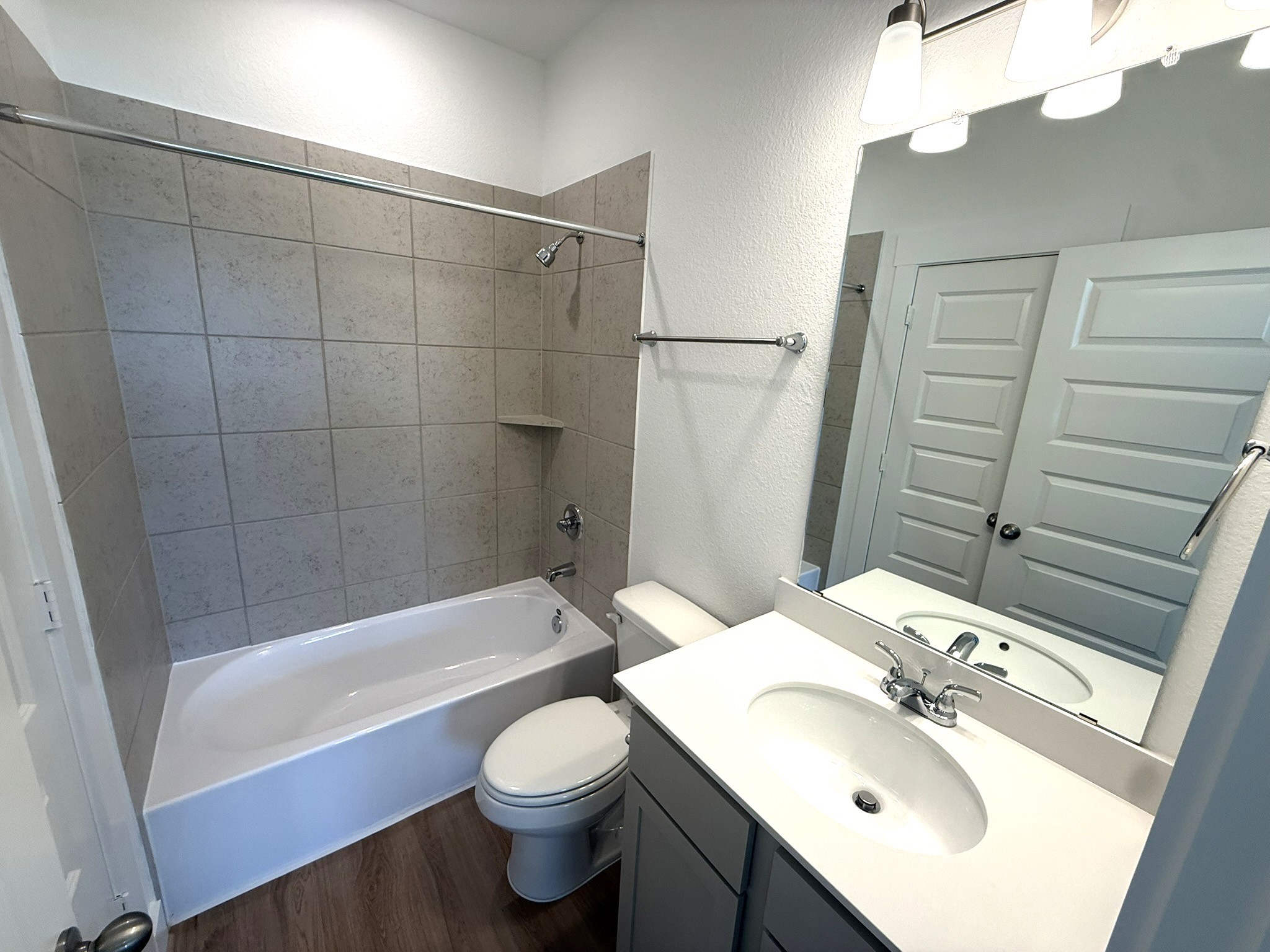 5314 Grace Sunshine Spring Spring, TX 77379 - Photo 16 of 23 Featuring a combination tub and shower, ample counter space, and bright lighting, this space is perfect for kids, guests, or busy mornings.