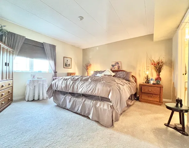 a bedroom with a workspace