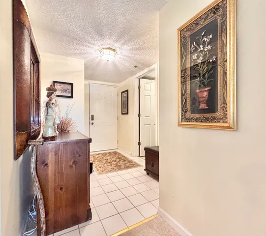 a kitchen with stainless steel appliances granite countertop a stove a sink dishwasher and a refrigerator