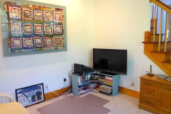 a room with furniture and a flat screen tv