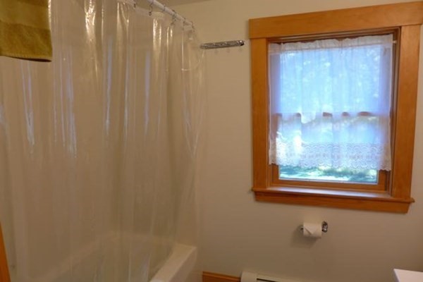 267 Great Plains Road West Tisbury, MA 02568 - Photo 24 of 34 a bathroom with a shower and a window