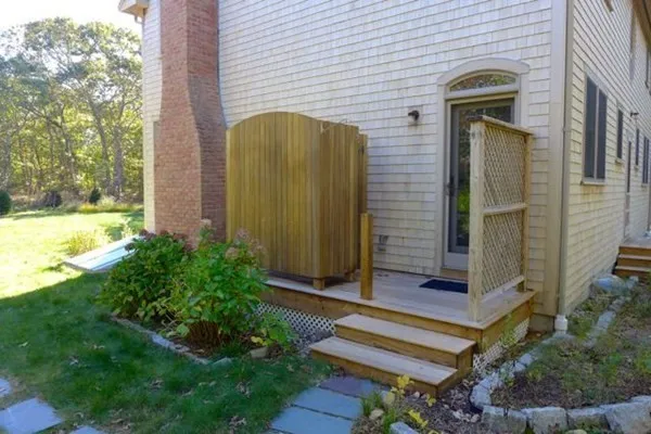 a front view of a house with a garden