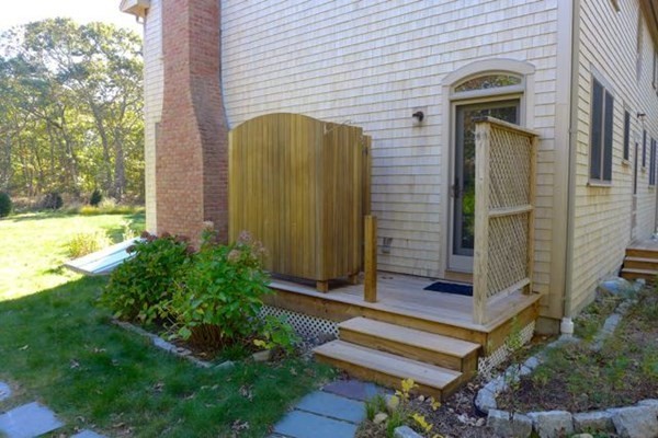 267 Great Plains Road West Tisbury, MA 02568 - Photo 27 of 34 a front view of a house with a garden
