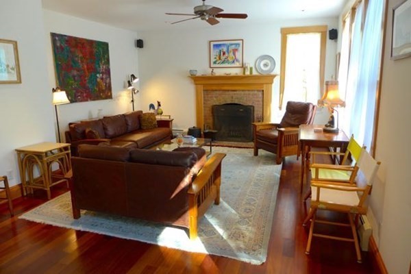 267 Great Plains Road West Tisbury, MA 02568 - Photo 4 of 34 a living room with furniture and a fireplace