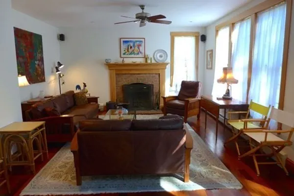 a living room with furniture and a fireplace