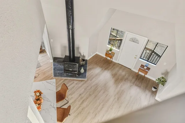 a view of a livingroom with furniture and a flat screen tv