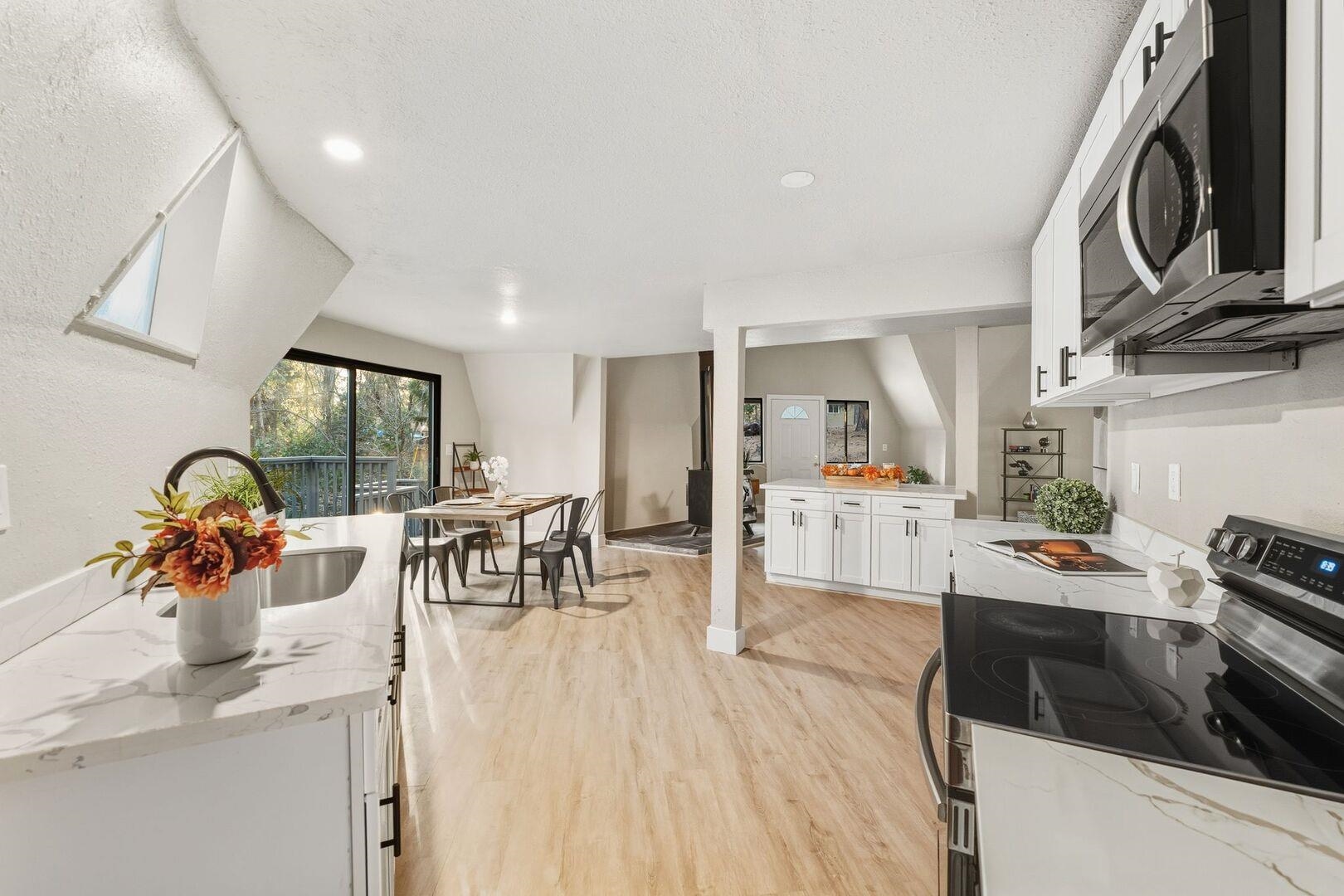 5841 Fallen Oak Drive Pollock Pines, CA 95726 - Photo 21 of 44 a living room with furniture a flat screen tv and kitchen view