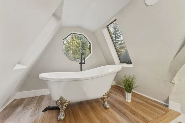 a view of a hallway with bathroom and front door