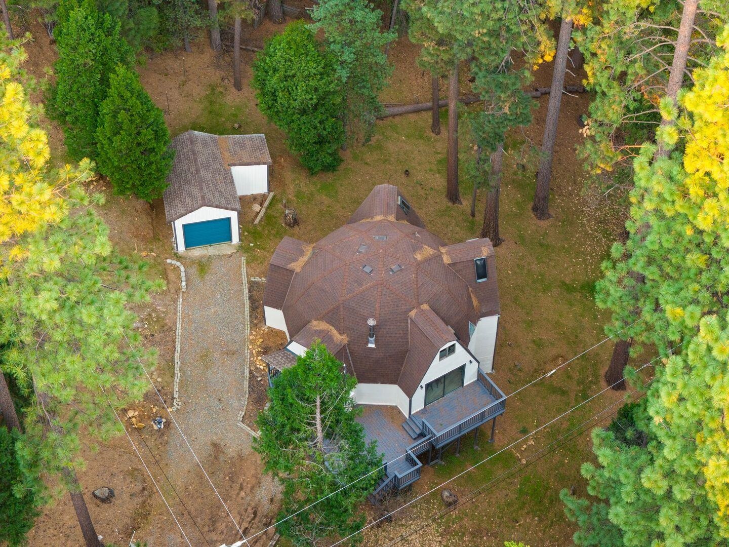 5841 Fallen Oak Drive Pollock Pines, CA 95726 - Photo 40 of 44 an aerial view of a house with a yard and trees