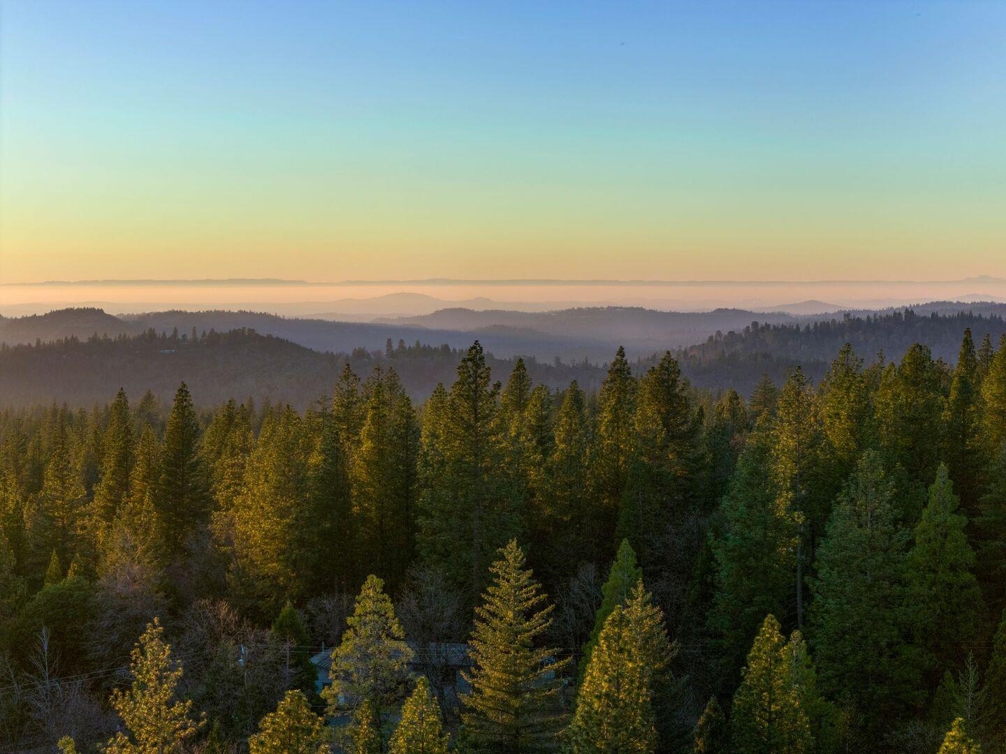 5841 Fallen Oak Drive Pollock Pines, CA 95726 - Photo 43 of 44 a view of a city with mountains in the background