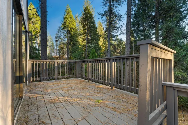 a view of backyard with wooden deck and floor
