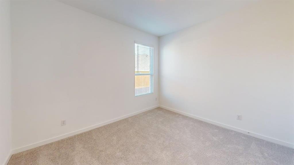 454 Ridge Drive Justin, TX 76247 - Photo 11 of 24 a view of an empty room with a window
