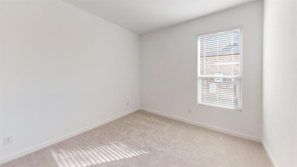 454 Ridge Drive Justin, TX 76247 - Photo 16 of 24 a view of an empty room with a window