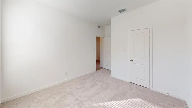 a bathroom with a toilet and a bath tub