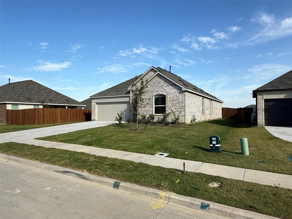 454 Ridge Drive Justin, TX 76247 - Photo 2 of 24 a front view of a house with a yard