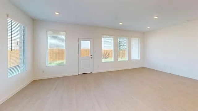an empty room with windows