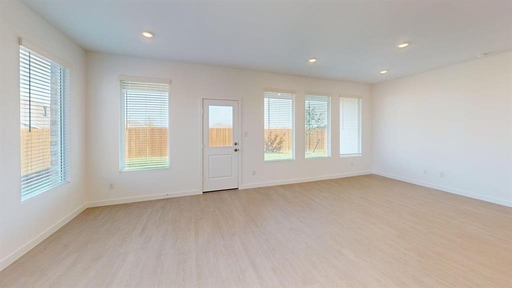 454 Ridge Drive Justin, TX 76247 - Photo 6 of 24 an empty room with windows