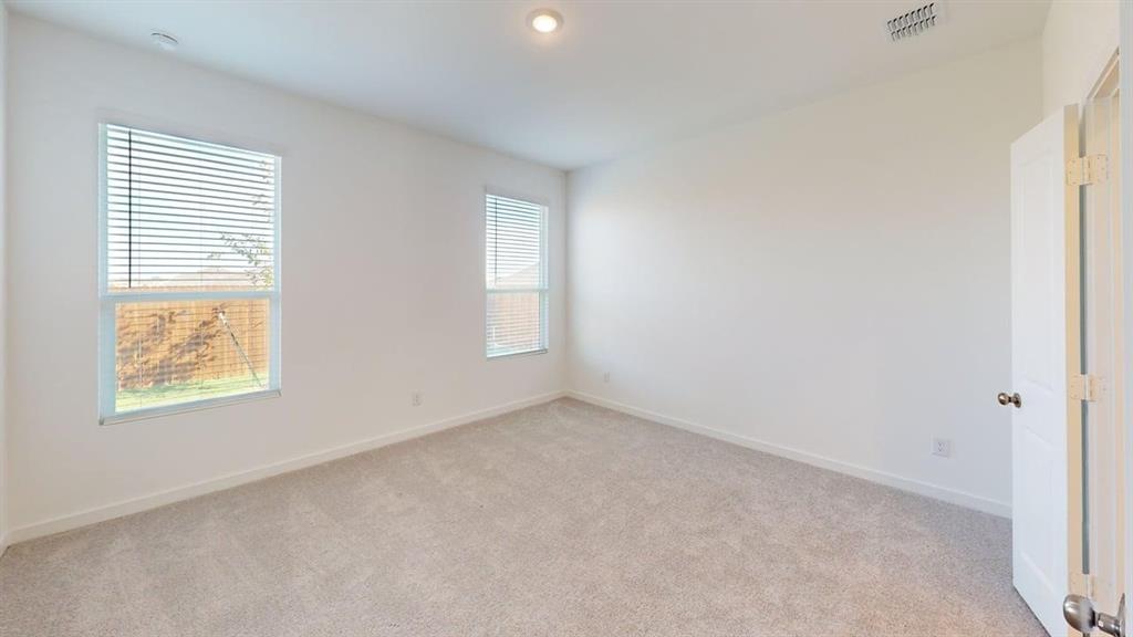 454 Ridge Drive Justin, TX 76247 - Photo 8 of 24 an empty room with windows