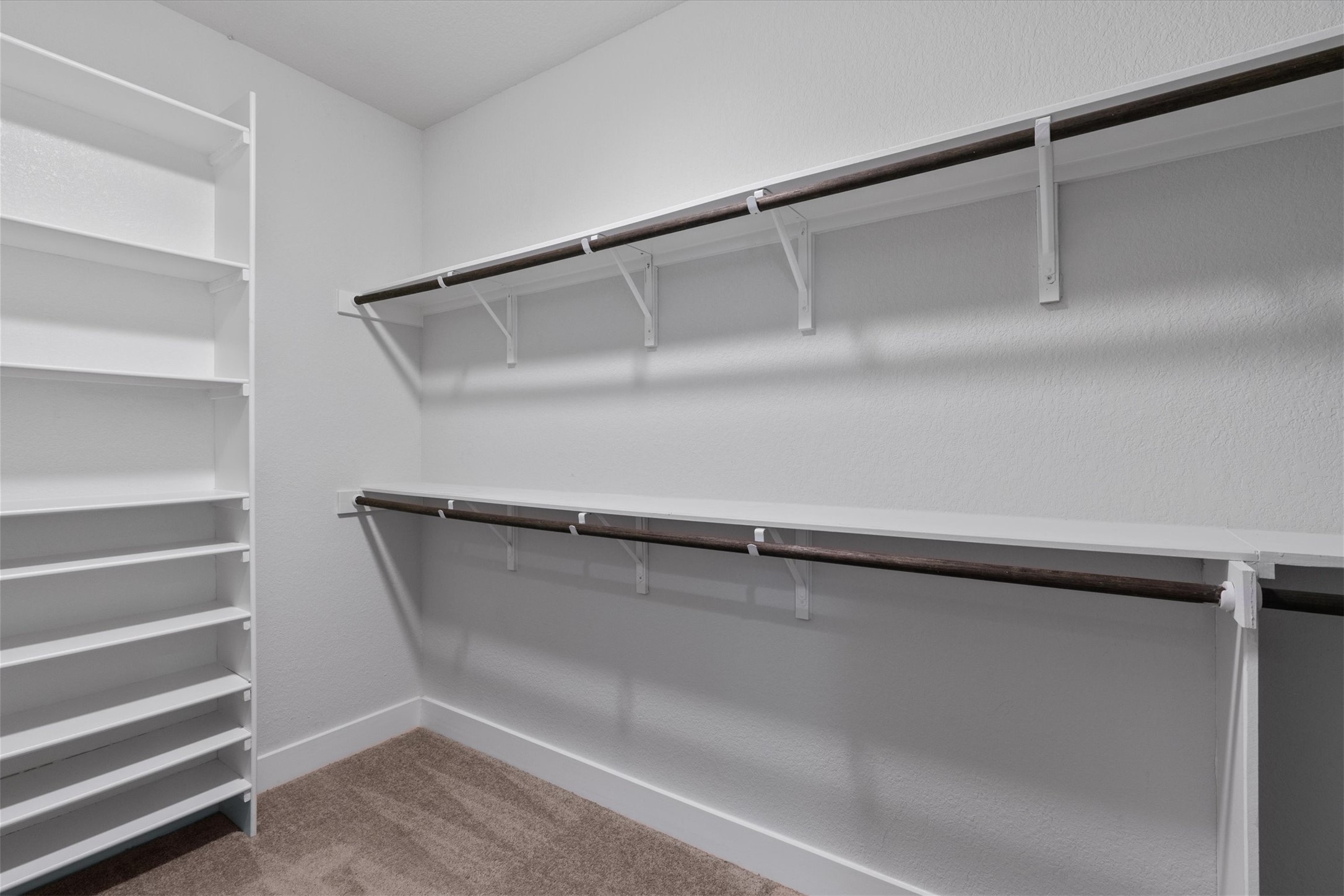 941 Del Raphael Drive Leander, TX 78641 - Photo 15 of 31 This walk-in closet has all the hanging space and built-in shelving you need to keep things organized