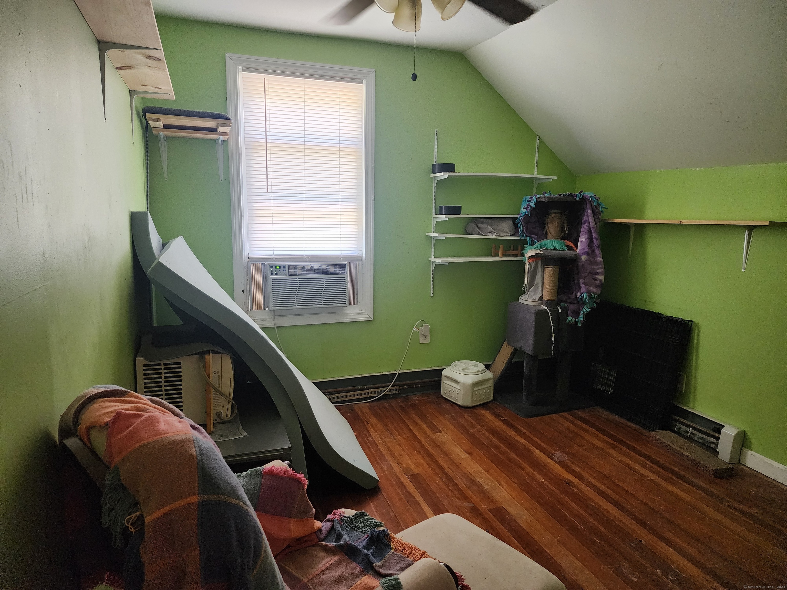 5 Avery St Extension Norwich, CT 06360 - Photo 14 of 17 a room with furniture and a wooden floor