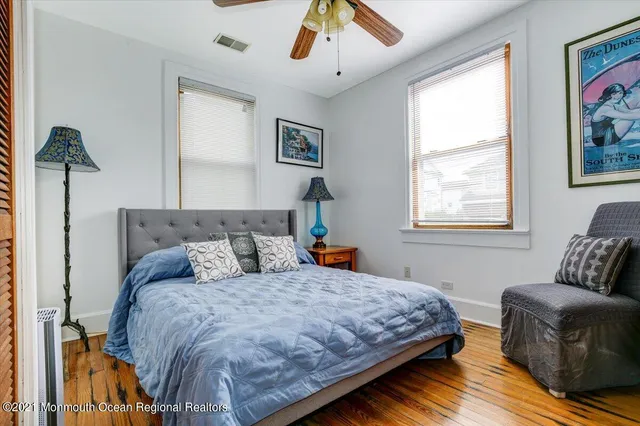 a bedroom with bed and window