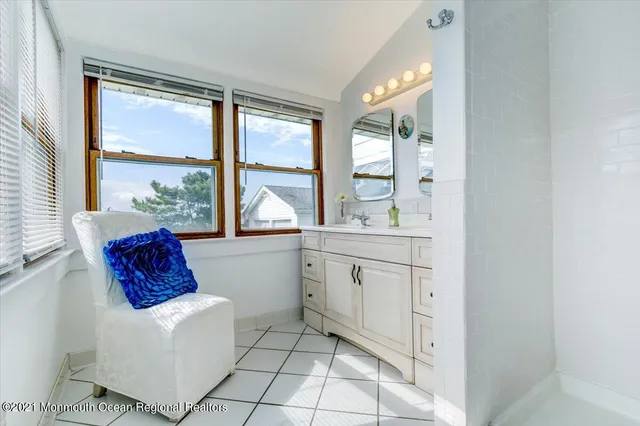 a spacious bathroom with a bathtub and window