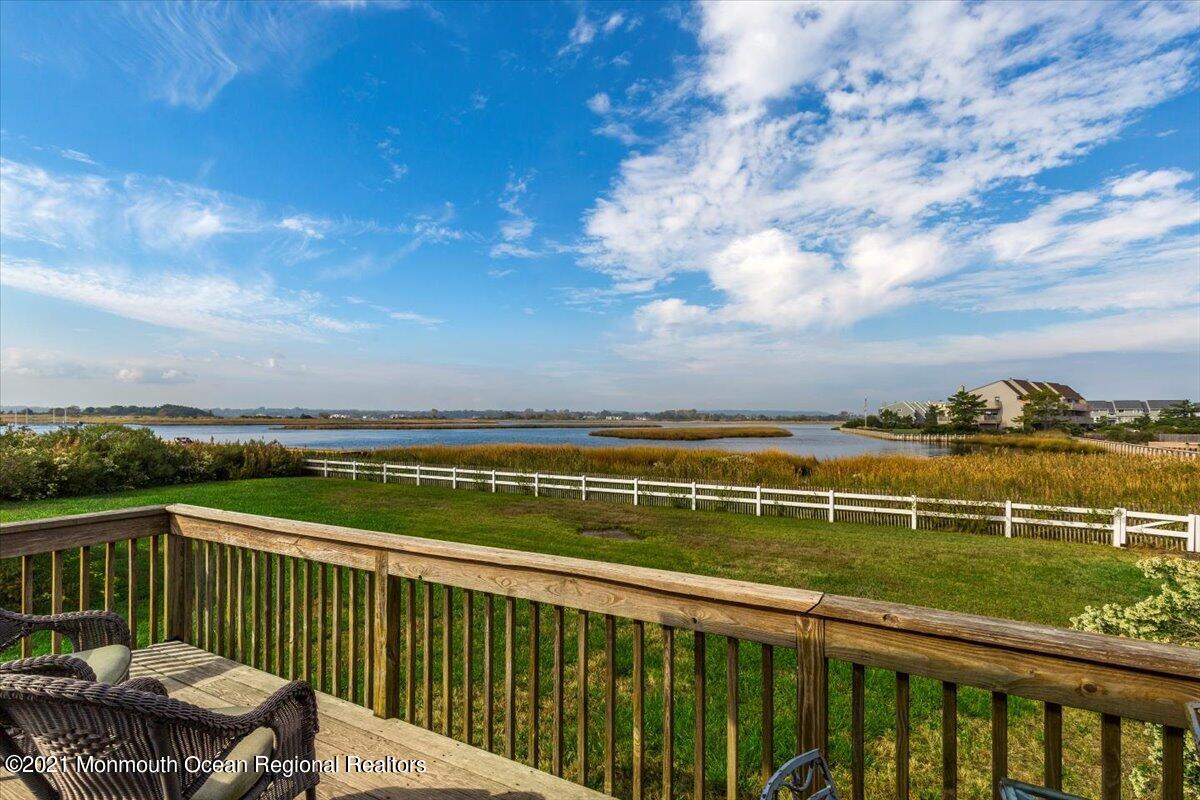 15 Riverview Road Monmouth Beach, NJ 07750 - Photo 8 of 38 a view of a balcony with wooden floor and fence