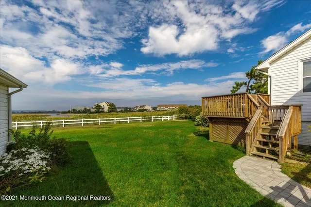 a view of a backyard with sitting area