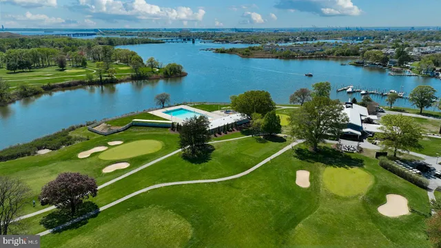 an aerial view of a house with a lake view