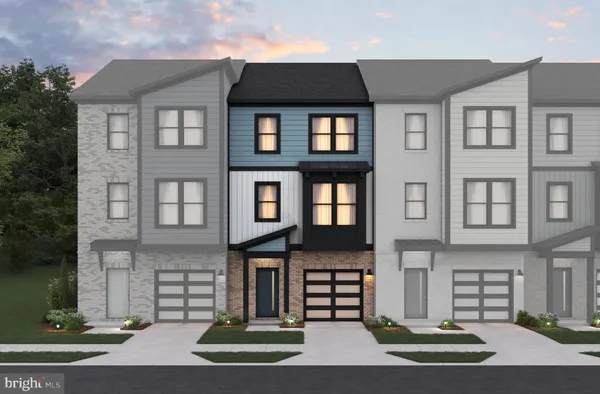 front view of a brick house with a yard