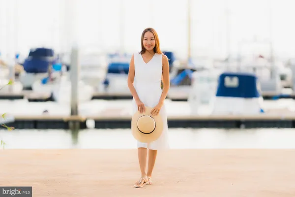 a backyard of a house with lots of green space and plants