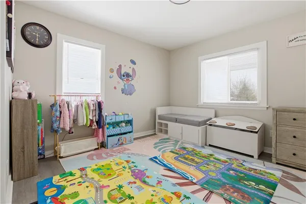 a bedroom with furniture and a window