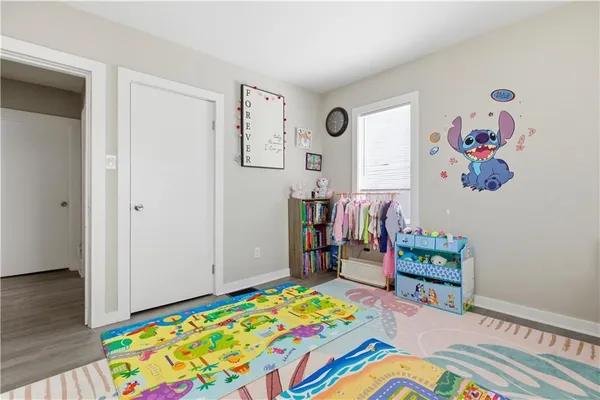 a room with furniture and painting on the wall