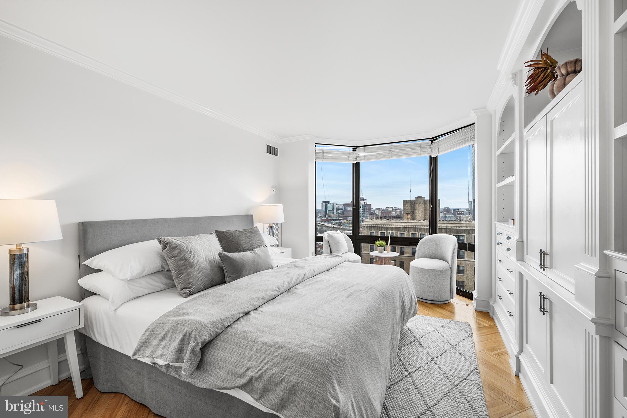 2018 Walnut Street, Unit 21L Philadelphia, PA 19103 - Photo 27 of 39 Serene bedroom with city skyline views.