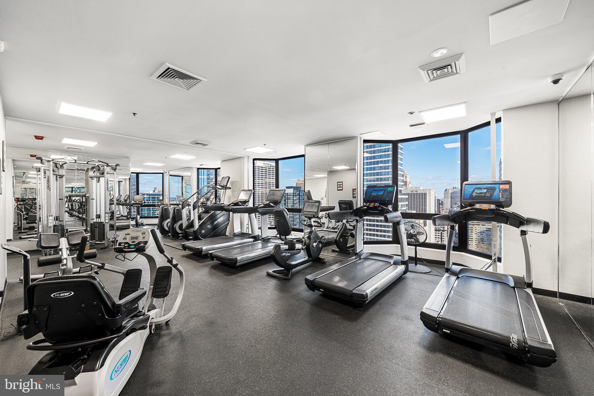 2018 Walnut Street, Unit 21L Philadelphia, PA 19103 - Photo 37 of 39 Modern fitness space with skyline views.