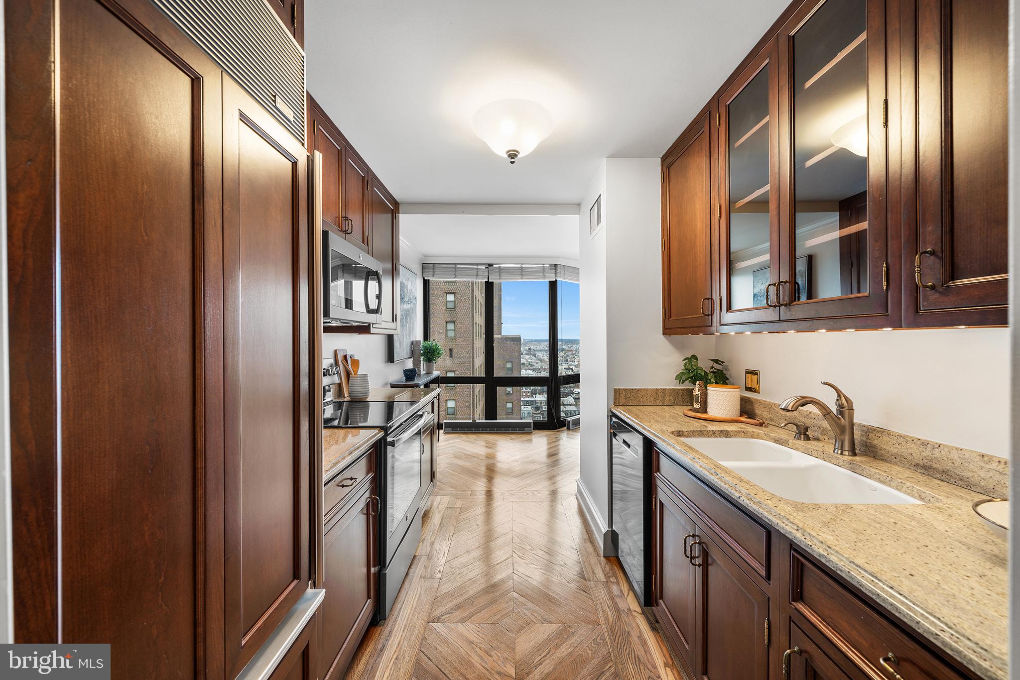 2018 Walnut Street, Unit 21L Philadelphia, PA 19103 - Photo 4 of 39 Sleek kitchen with city skyline views.