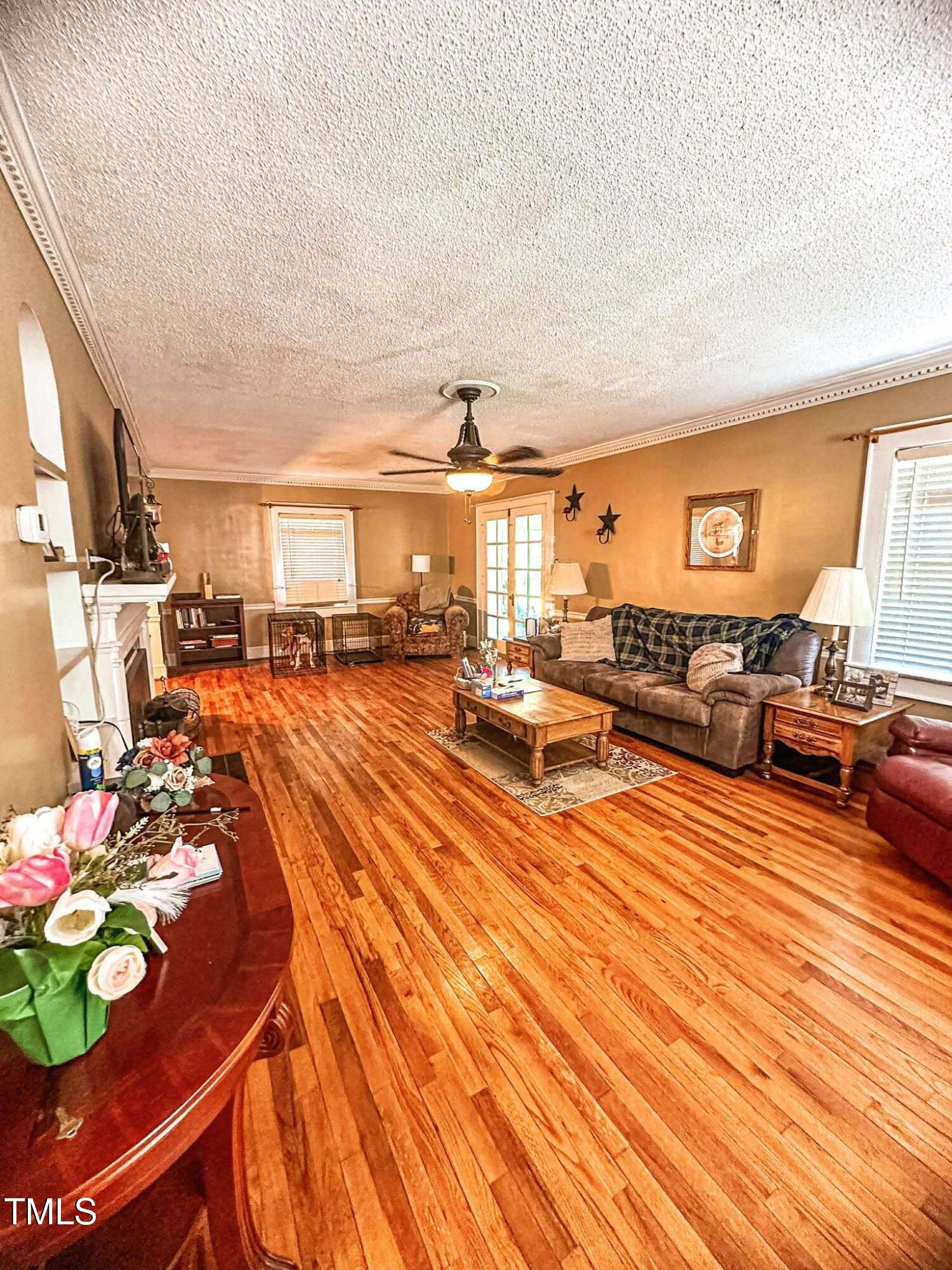 8683 Highway 15 Bullock, NC 27507 - Photo 11 of 36 a living room with furniture and a wooden floor