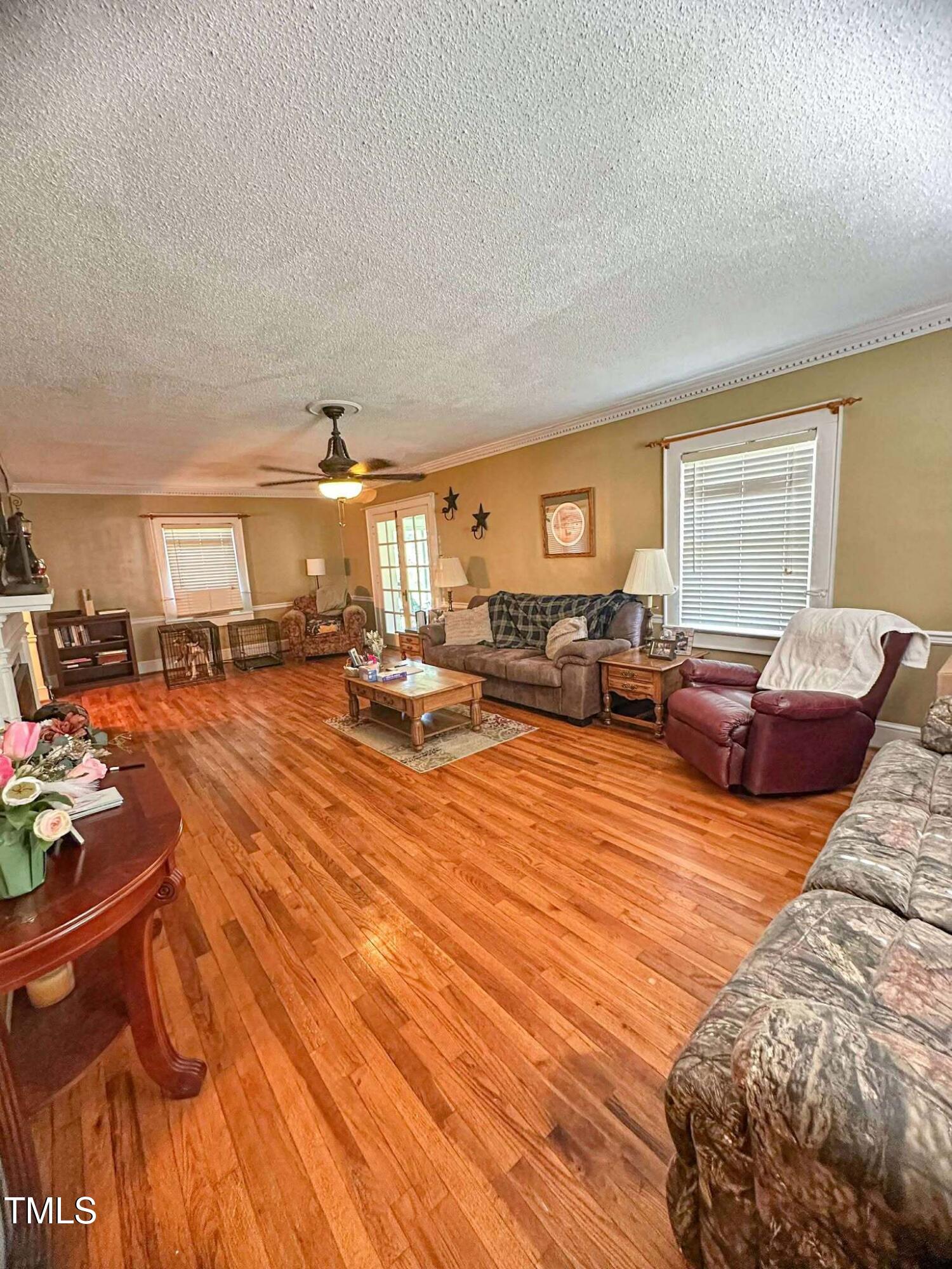 8683 Highway 15 Bullock, NC 27507 - Photo 12 of 36 a living room with furniture kitchen view and a window