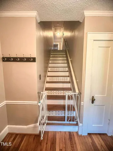 a view of entryway with wooden floor