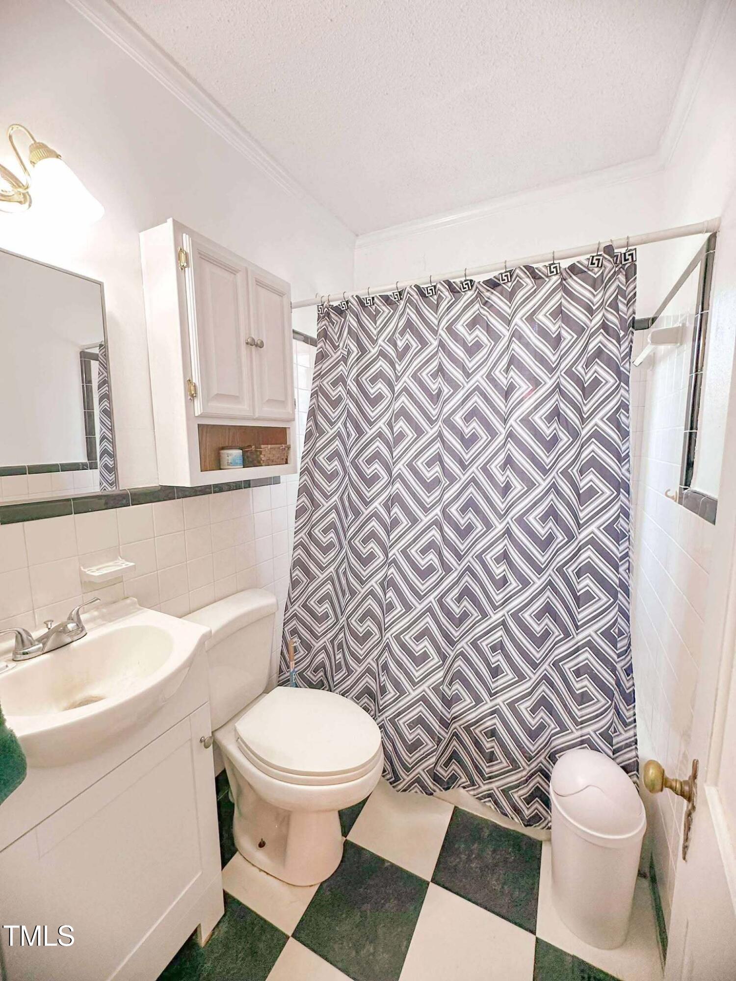 8683 Highway 15 Bullock, NC 27507 - Photo 22 of 36 a white toilet sitting next to a bathroom sink