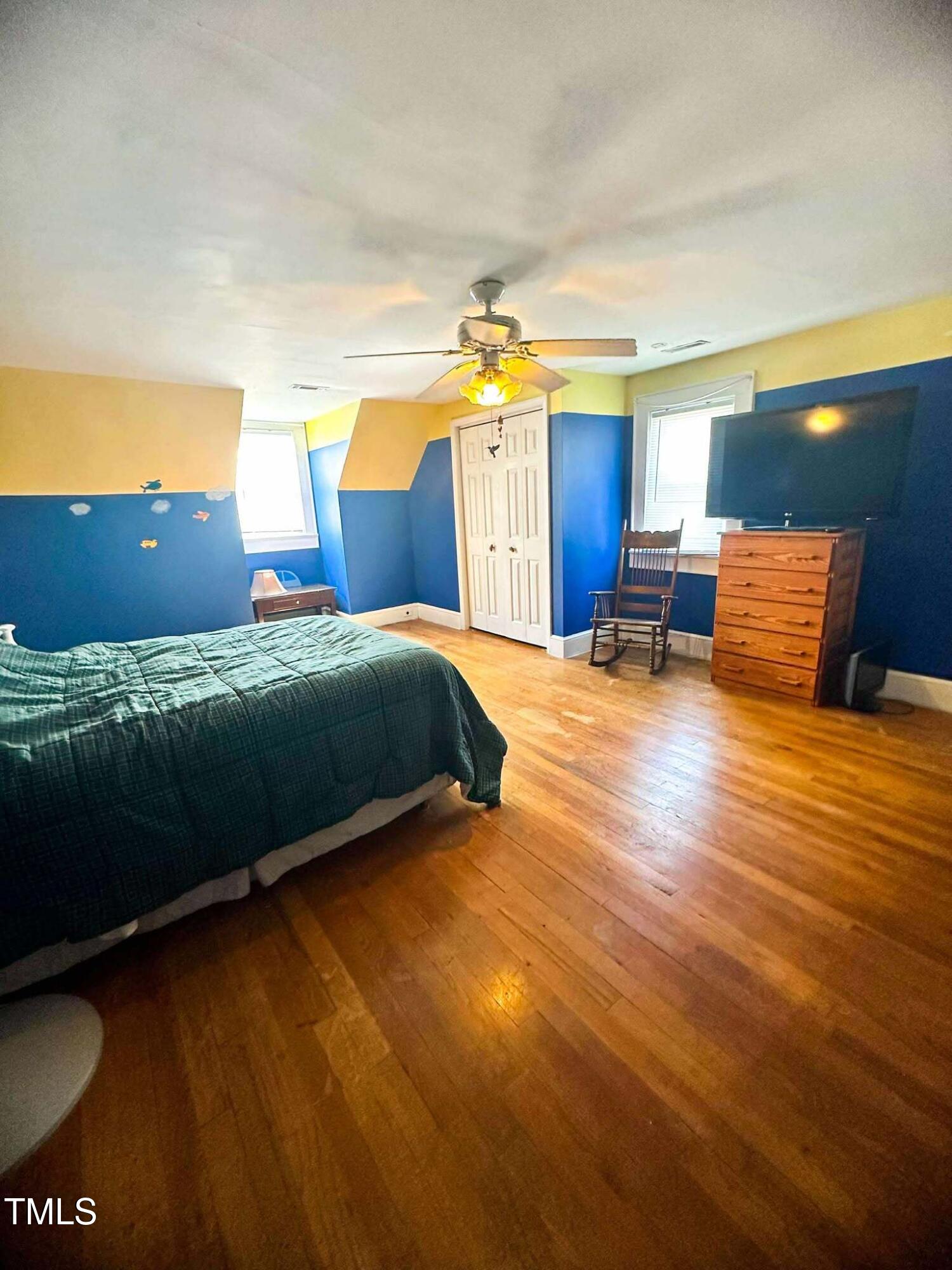 8683 Highway 15 Bullock, NC 27507 - Photo 24 of 36 a bedroom with a bed and cabinets