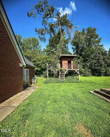 a house view with a garden space