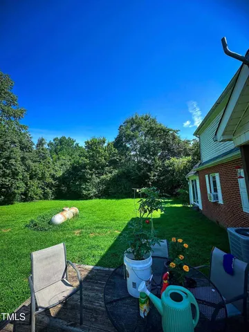 a view of a table and chairs in patio