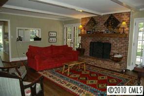 1156 Andover Road Charlotte, NC 28211 - Photo 3 of 8 a living room with furniture and a fireplace